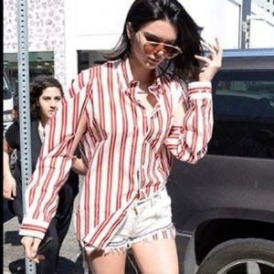 Red white striped cut out sleeve button up seen on Kendall Jenner